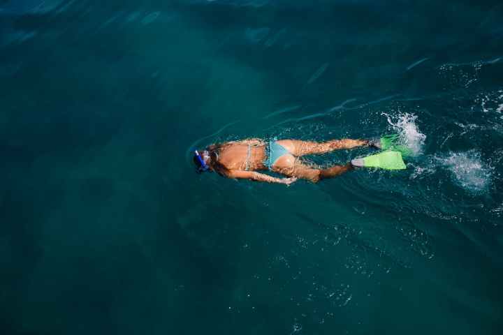 a person swimming in a body of water