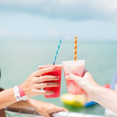 a woman holding a glass of water