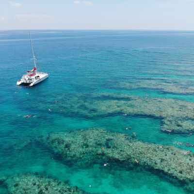 a boat on a body of water next to the ocean