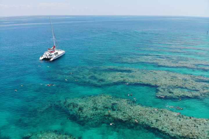 a boat on a body of water next to the ocean
