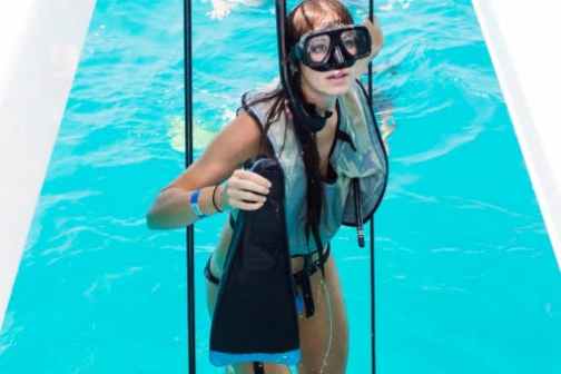 a person standing in front of a pool of water